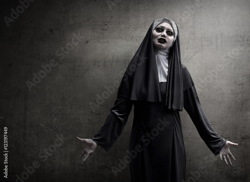 Asian woman dressed in evil nun