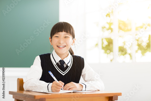 happy teenager girl study in the classroom
