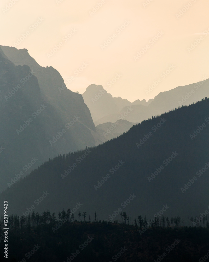 Fototapeta premium Highlighted rocky peaks of mountains