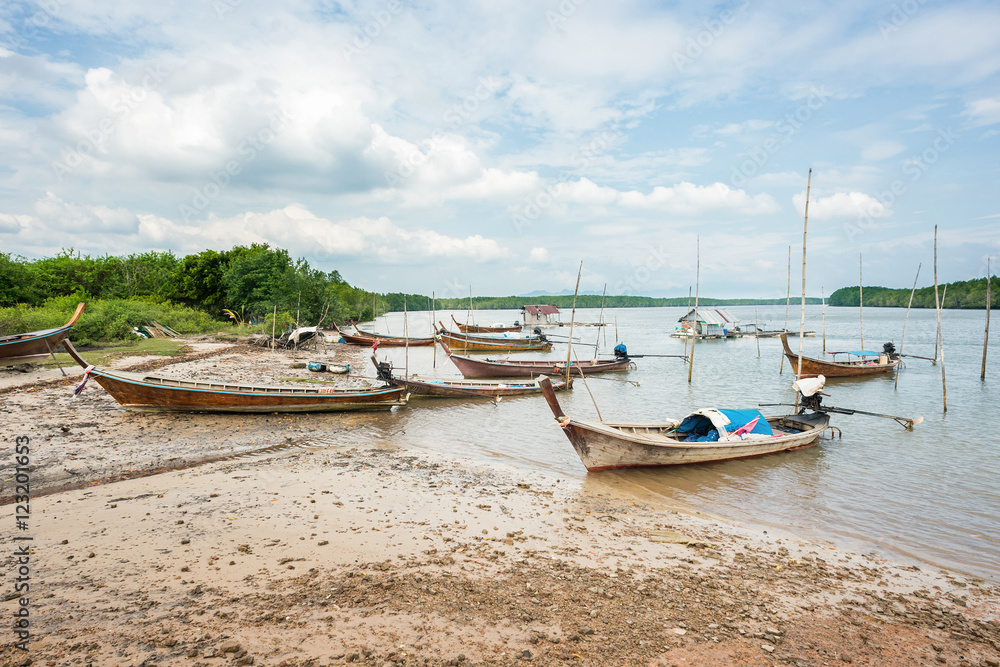 Fishing boats parking at mangrove beach