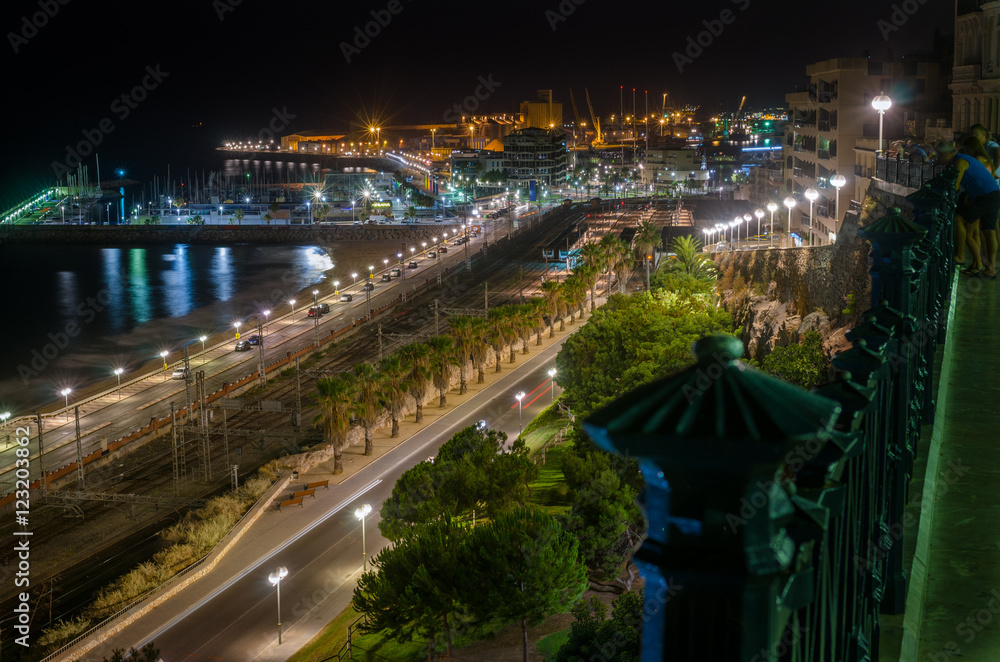 View on Tarragona railways, beach and port at night, Spain View on Tarragona railways, beach and port at night, Spain