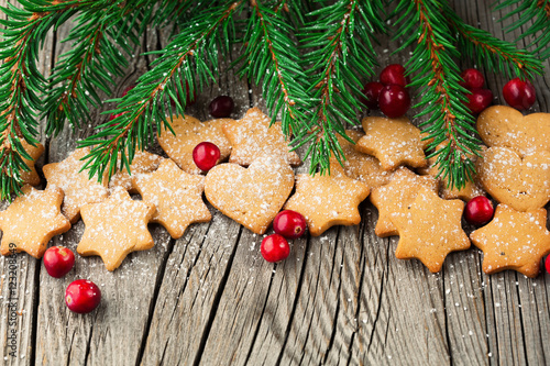 Christmas Gingerbread Cookies Star Shape in Stack. Holiday concept decorated with Fir Tree. Selective focus