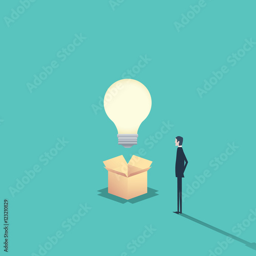 Creativity concept think outside the box with businessman and a lightbulb.