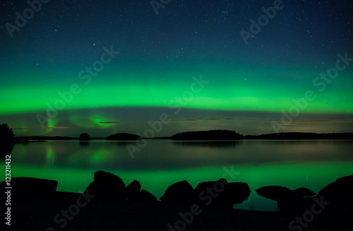 Scenic view of northern lights over calm lake