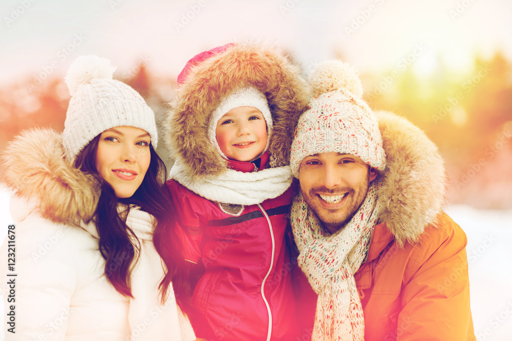 happy family with child in winter clothes outdoors happy family with child in winter clothes outdoors