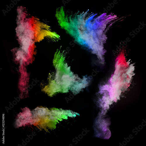 Explosion of colored powders on black background