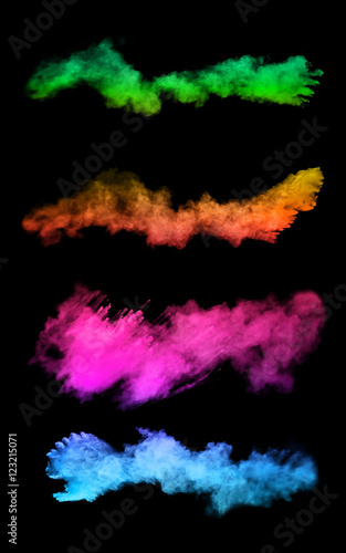 Explosion of colored powders on black background