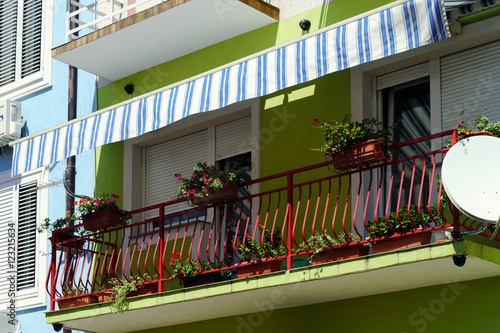 House with balcony on sea resort, sunny day, touristic concept. photo