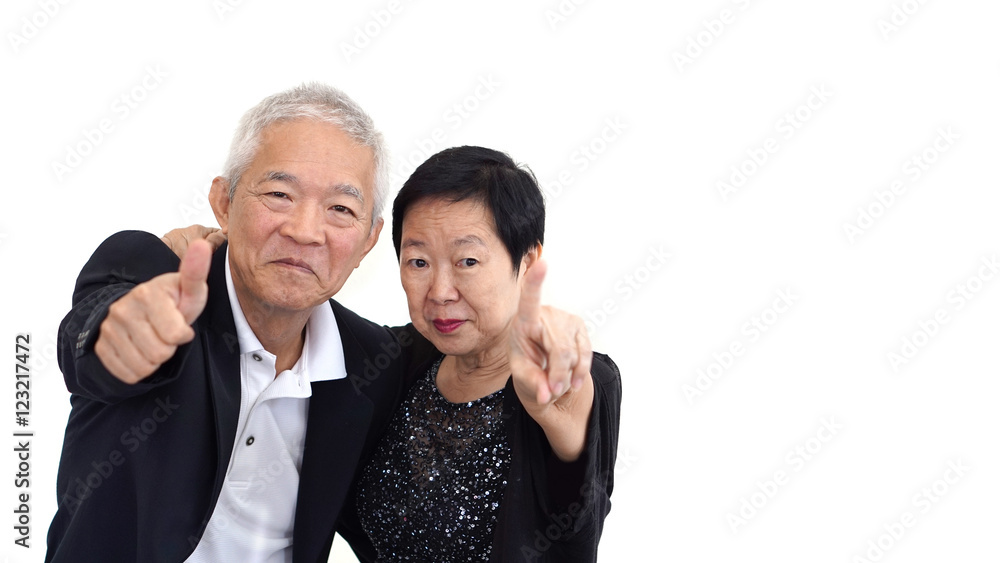 Asian senior couple in business attire showing hand gesture thum Asian senior couple in business attire showing hand gesture thum