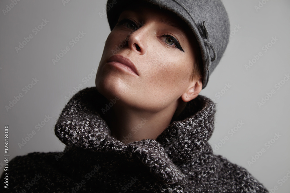 beauty classic makeup on a woman wears grey coat and hat beauty classic makeup on a woman wears grey coat and hat
