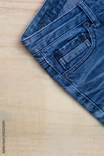 Blue jeans design on wood background, jean fashion