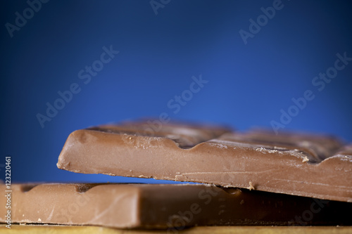 Chocolate bars on blue background