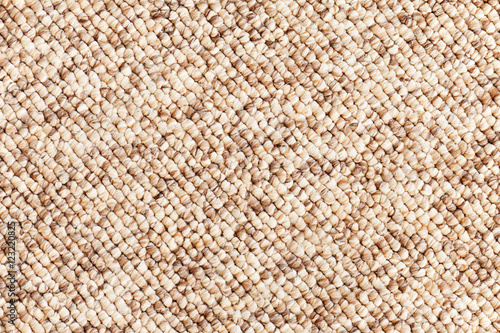 Beige - brown carpet texture for use as background. Closeup.