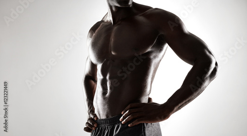 Obraz na plátně African man with muscular body on grey background
