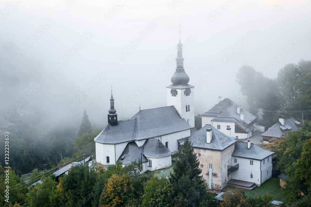 Cold misty autumn morning in old mining village - Spania Dolina, Slovakia
