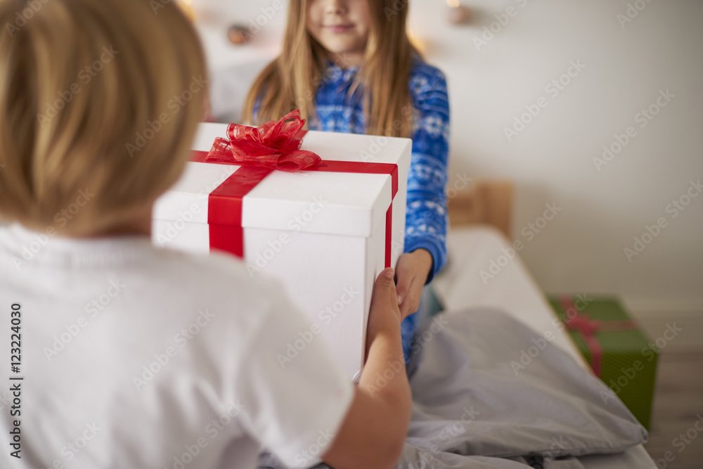 Sharing the Christmas present in the bed Sharing the Christmas present in the bed