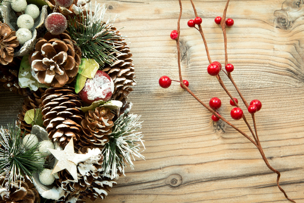 Christmas wreath and branch with red fruits