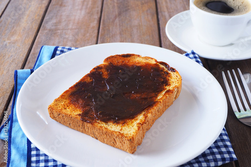Close up of Australian breakfast with Vegemite spread on a sliced wholewheat toast.