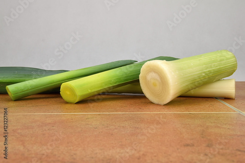 Leek vegetables isolated, covered with drops of water. Allium porrum. White background.