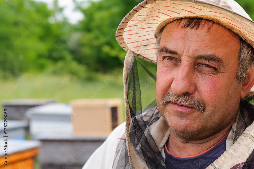 portrait of a beekeeper on apiary portrait of a beekeeper on apiary