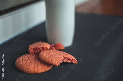 Chocolate, pink, round and delicious cookies on a gray background. Table. White termus photo