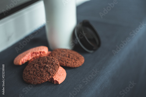 Chocolate, pink, round and delicious cookies on a gray background. Table. White termus photo