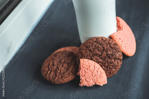 Chocolate, pink, round and delicious cookies on a gray background. Table. White termus photo