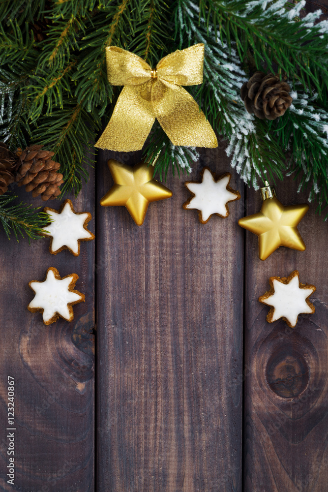 dark wooden background with fir branches and decorations dark wooden background with fir branches and decorations