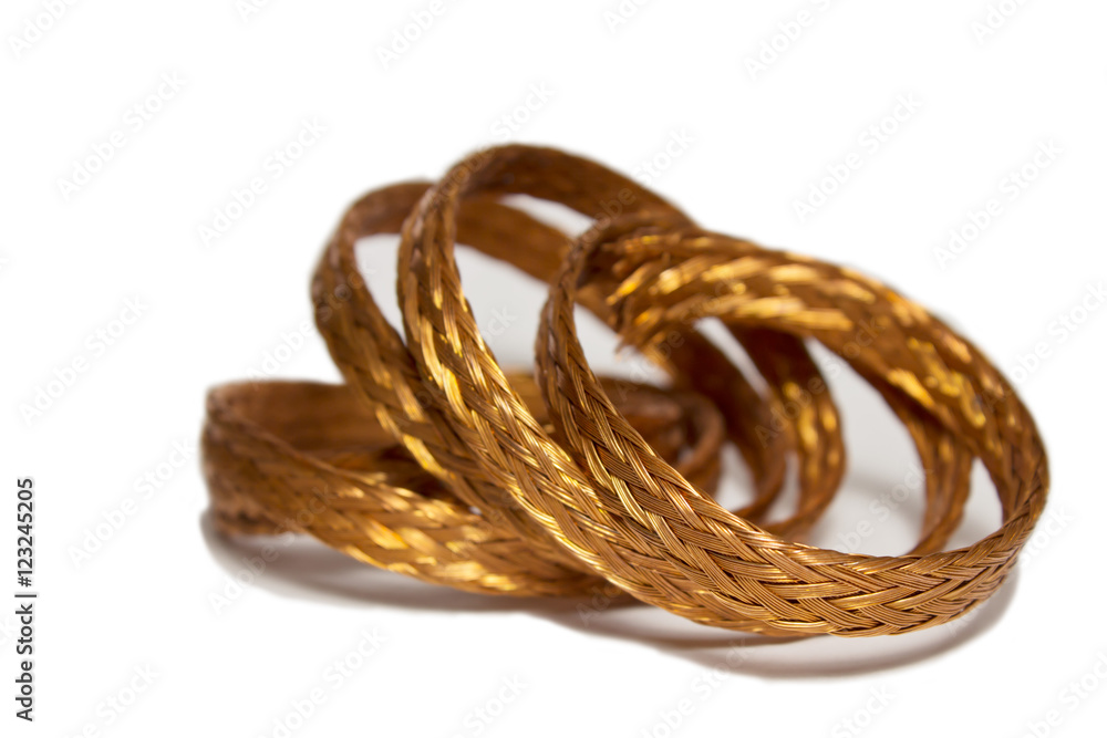 braided copper wire twisted ring on a white background with space for text.
braided copper wire twisted ring on a white background with space for text.
