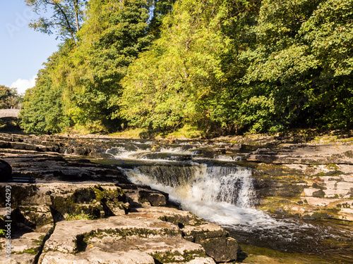 Stainforth Force waterfall in early Autumn, North Yorkshire, UK photo