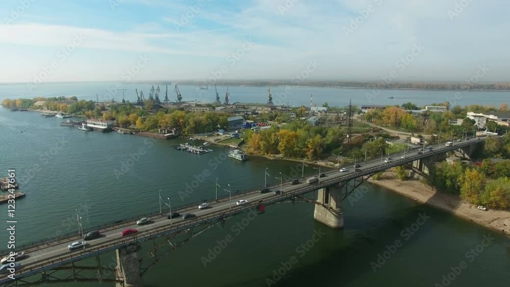 Flying near the bridge at Samara river estuary. Samara river flows into the Volga river. Drone moving down. 4K Aerial stock footage clip.
Flying near the bridge at Samara river estuary. Samara river flows into the Volga river. Drone moving down. 4K Aerial stock footage clip.