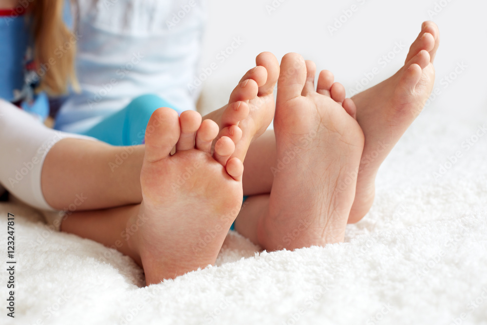 Funny children's foots is barefoot, closeup. This is the concept Funny children's foots is barefoot, closeup. This is the concept