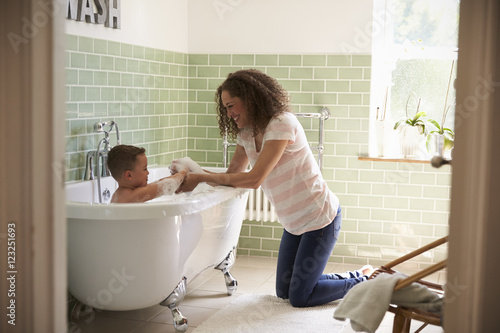 Mother And Son Having Fun At Bath Time Together