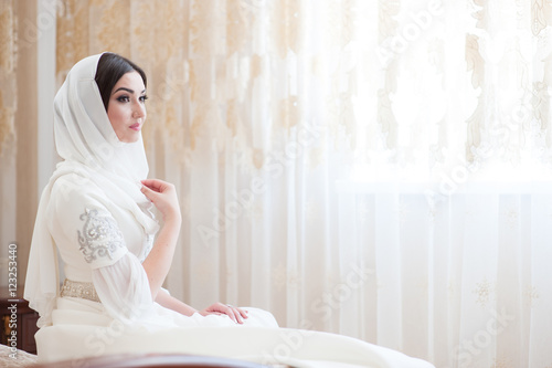 beautiful caucasian bride in traditional dress photo
