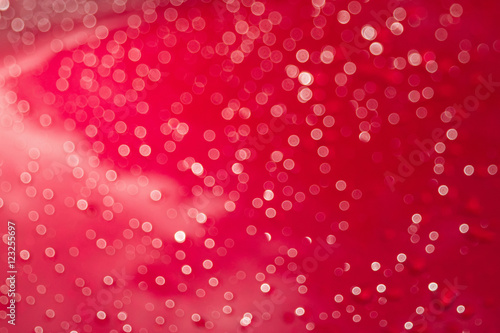 Abstract glittering red bokeh background