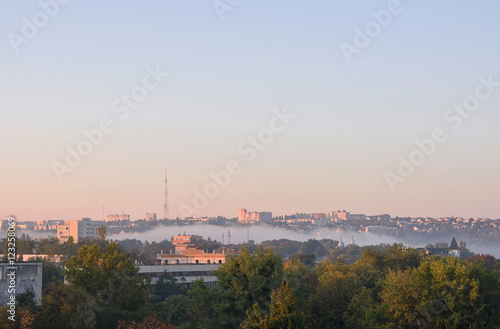 Sunrise with fog over the Valea Morilor lake in Chisinau, Moldova. View on the national tv station antenna © frimufilms