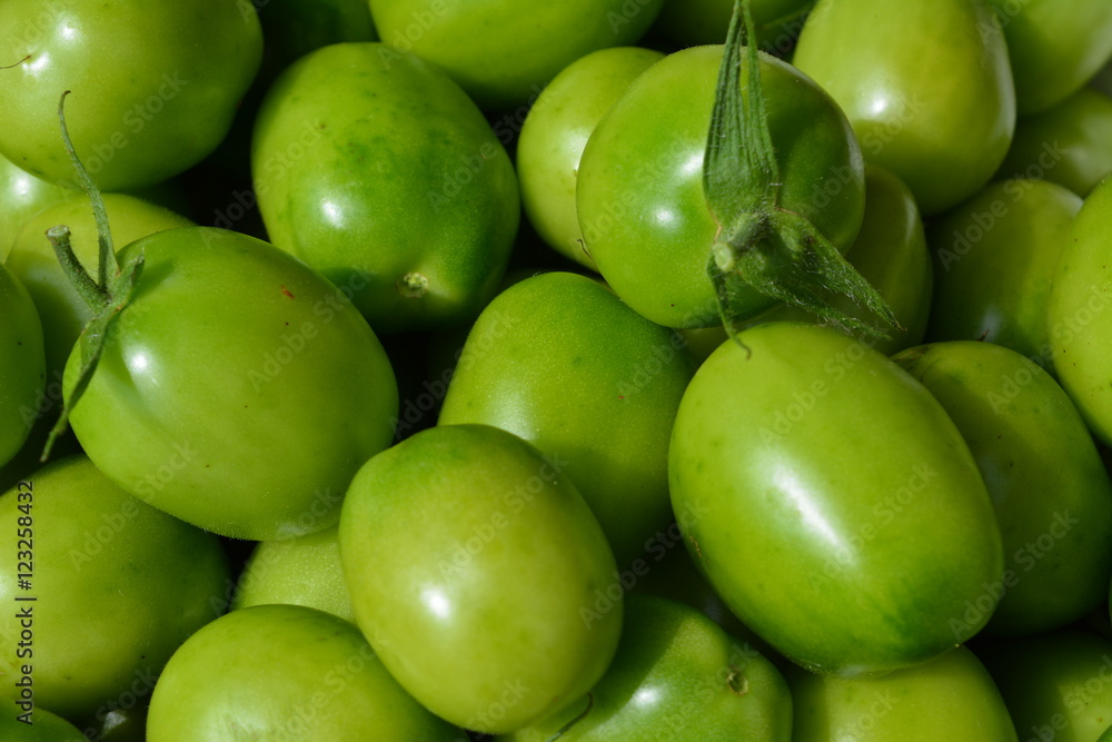 green tomatoes close up, texture, background green tomatoes close up, texture, background