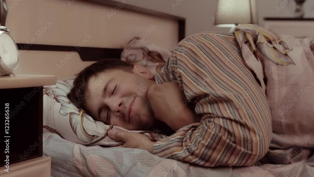 Happy young man going to bed with pleasure Happy young man going to bed with pleasure