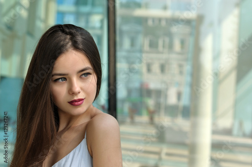 She turned her head to her shoulder and looking to the side Free Download She turned her head to her shoulder and looking to the side - GFXLoad