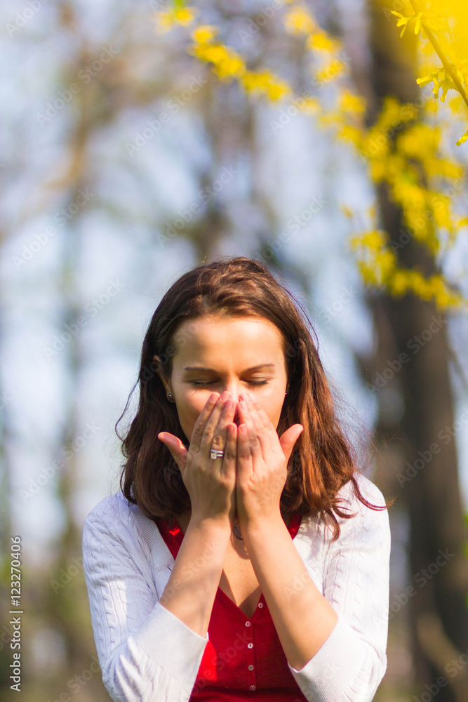 Woman sneezing Woman sneezing