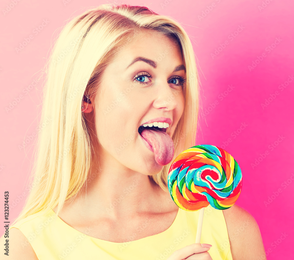 Young woman eating a lollipop