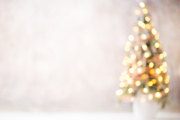 Defocused christmas tree silhouette with blurred lights.