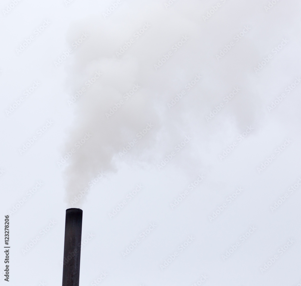 Smoke from a pipe on a cloudy sky Smoke from a pipe on a cloudy sky