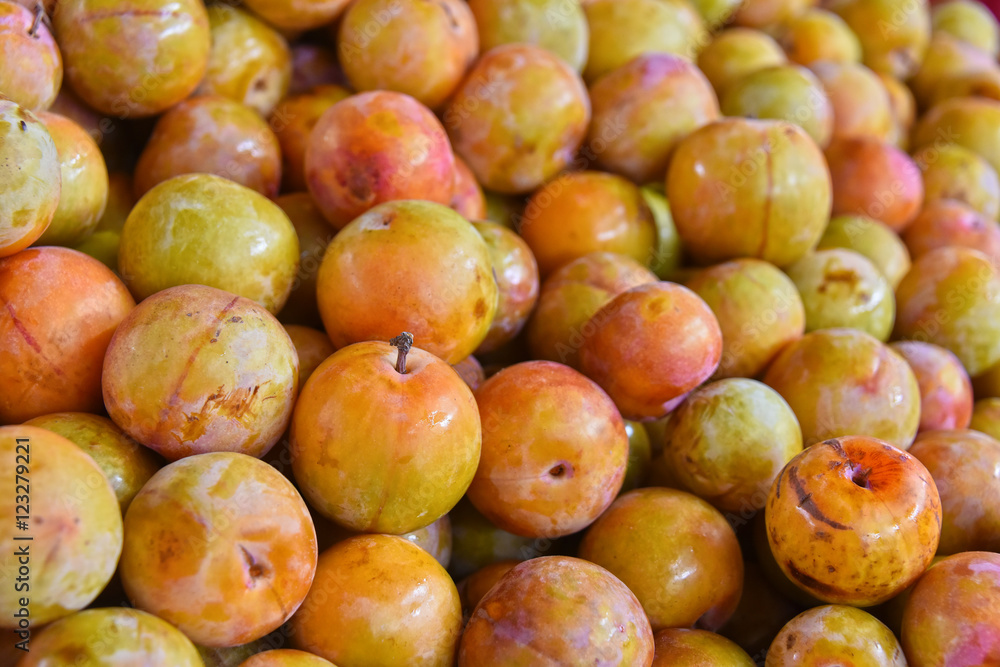 Fresh organic plums on street market stall Fresh organic plums on street market stall