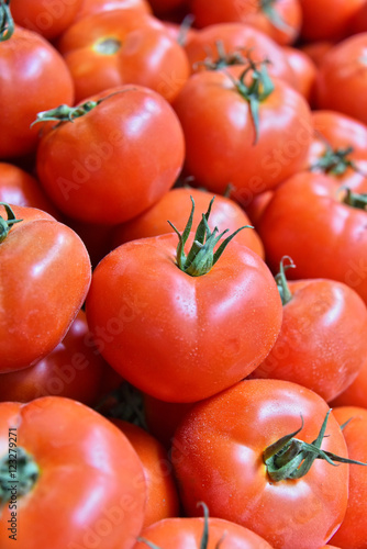 Fresh organic tomatoes on street market stall