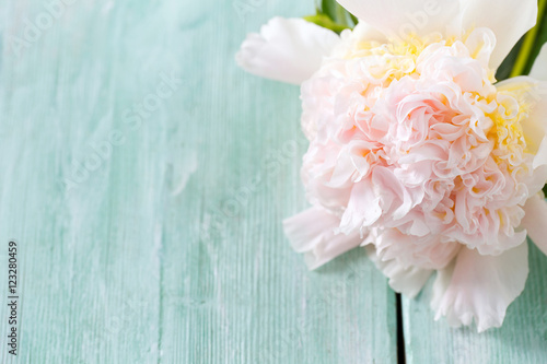 peonies on wooden surface