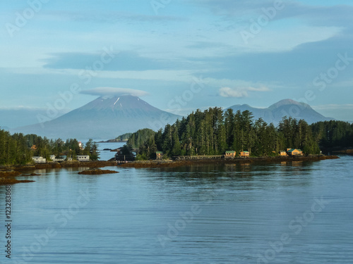 Ocean with mountains, clouds, islands and trees