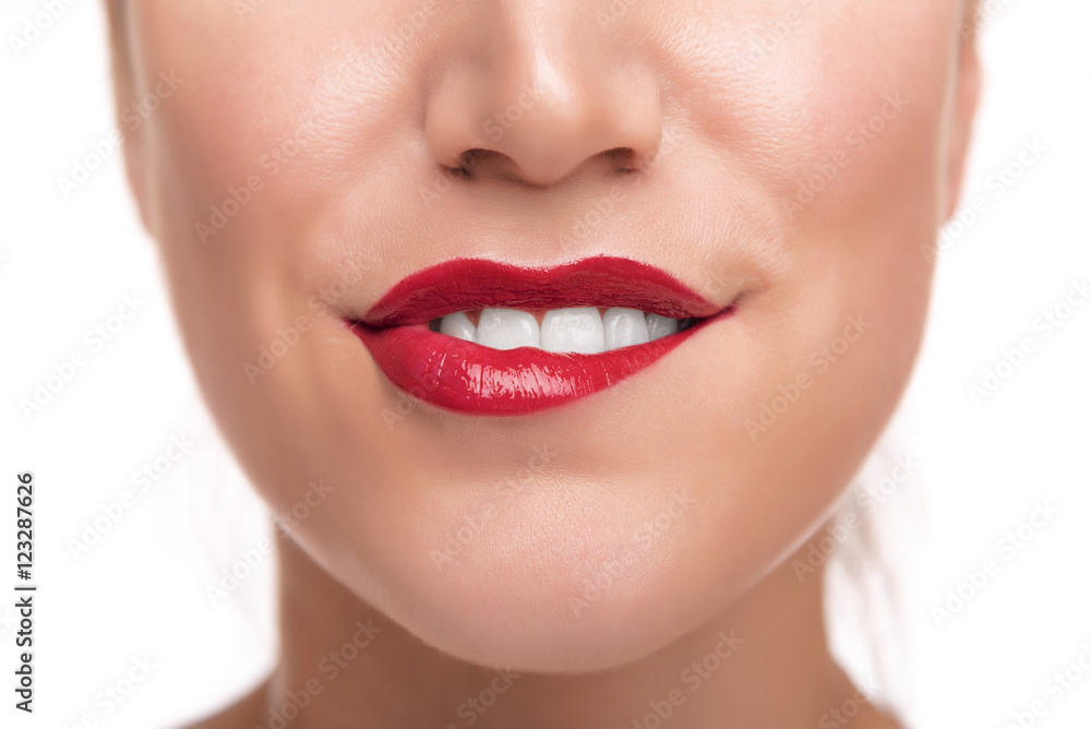 Obraz premium Sensuous woman biting red lips.