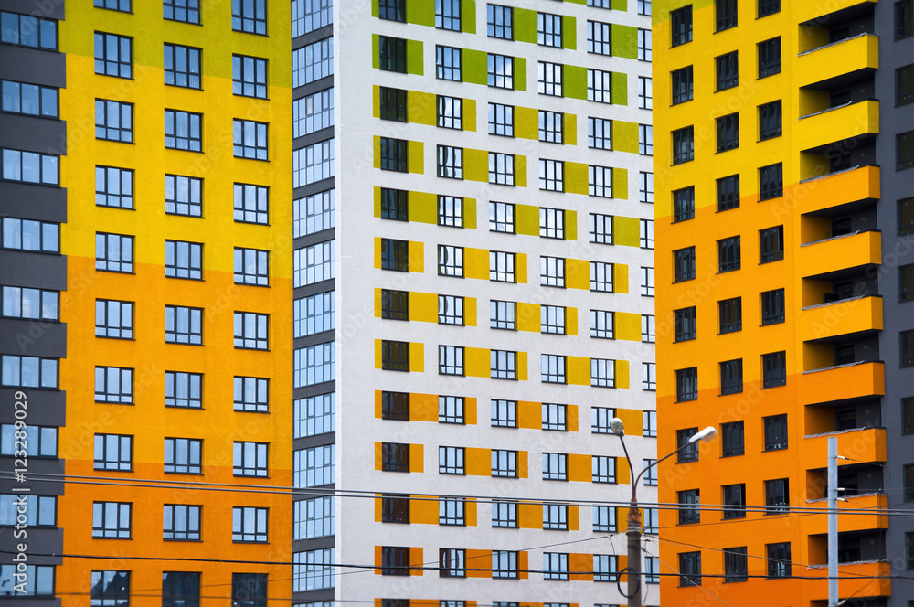 City landscape - color bright new high-rise buildings to life with windows in a row