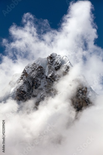 Mount Arakam Tse and clouds near Cho La Pass